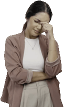 Woman looking pained with hand on forehead.